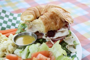 Turkey croissant sandwich with house salad and homemade dressing