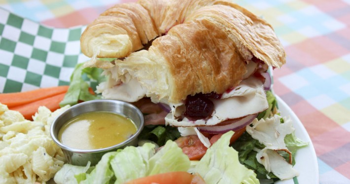 Turkey croissant sandwich with house salad and homemade dressing