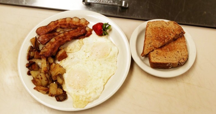 Bacon and egg breakfast with cottage fried potatoes