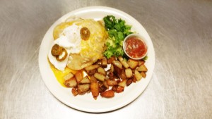 Huevos Rancheros with cottage fried potatoes and salsa